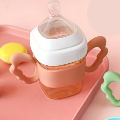 Poignée biberon silicone orange ergonomique autonomie bébé