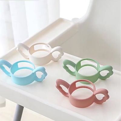 Poignées biberon silicone ergonomiques 4 couleurs orange blanc vert rose